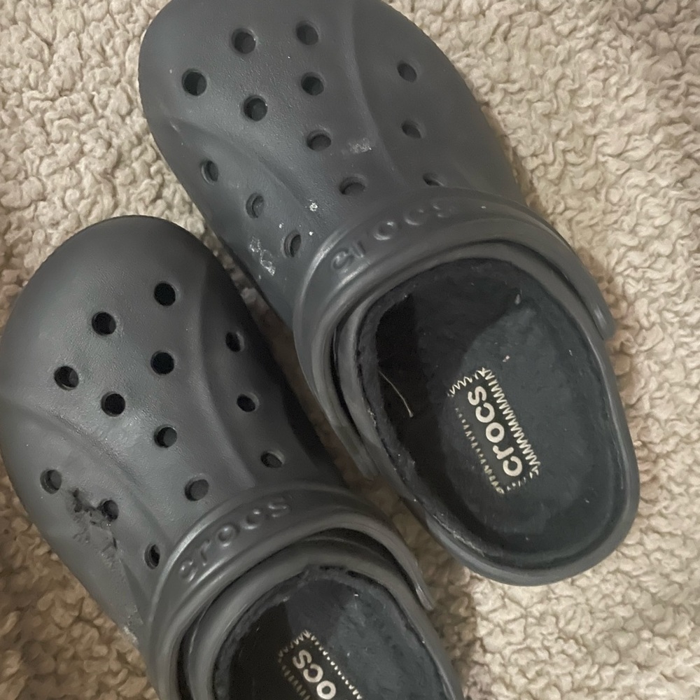 Womens size 7 fur crocs worn twice. A moving box ripped the left corner a little